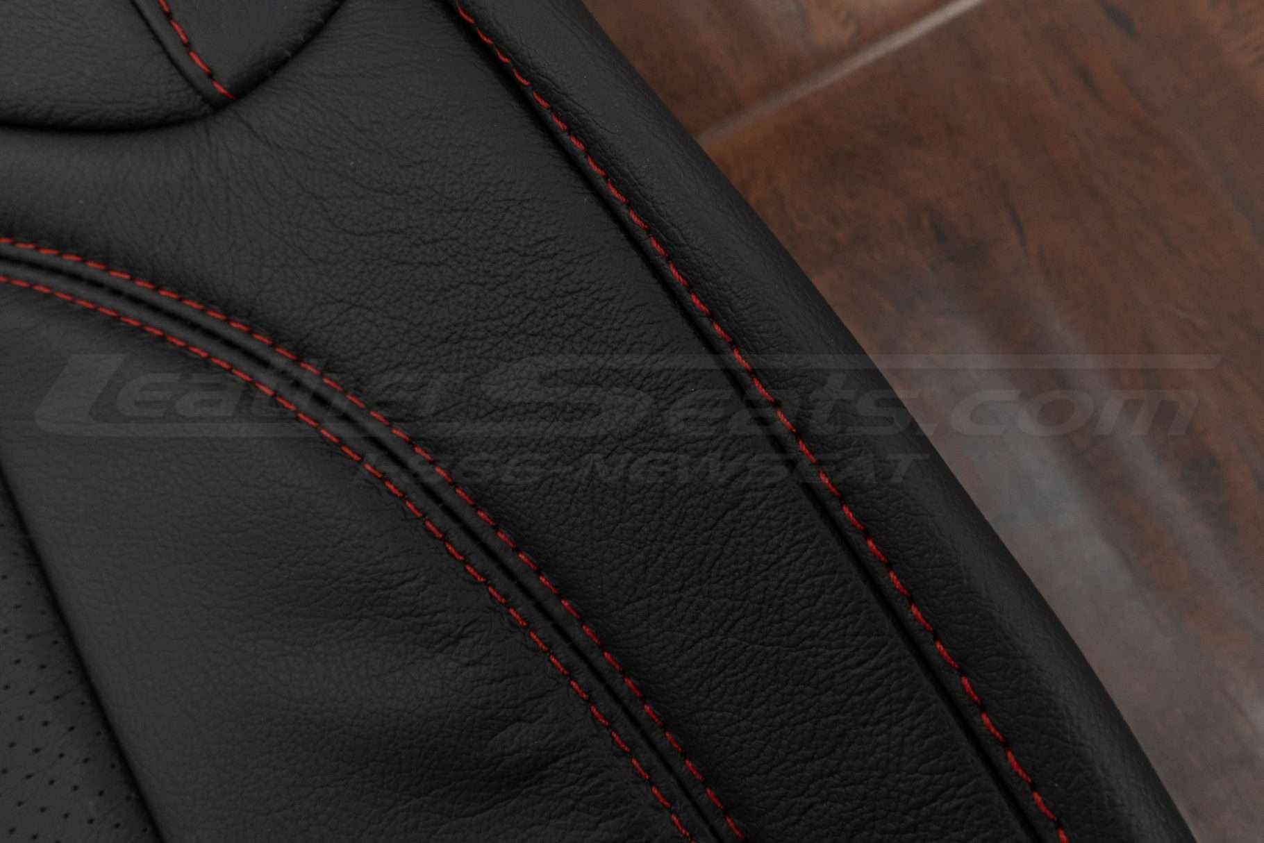 Contrasting Red stitching on Black leather