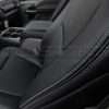 Contrast silver stitching on Black leather close-up