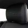 Installed black leather headrest with contrasting silver stitching