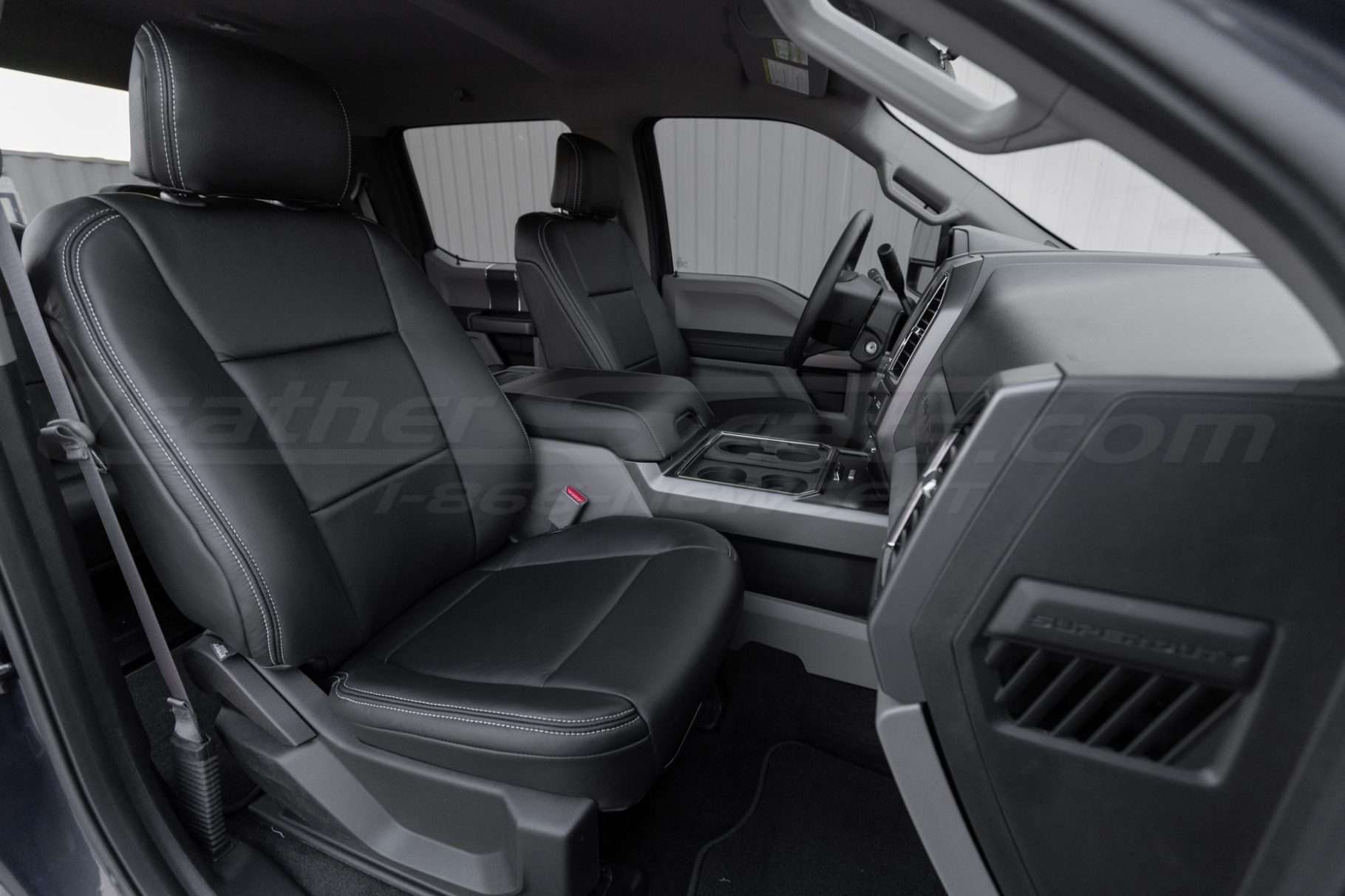 Ford SuperDuty with installed black leather seats and silver stitching - front passenger