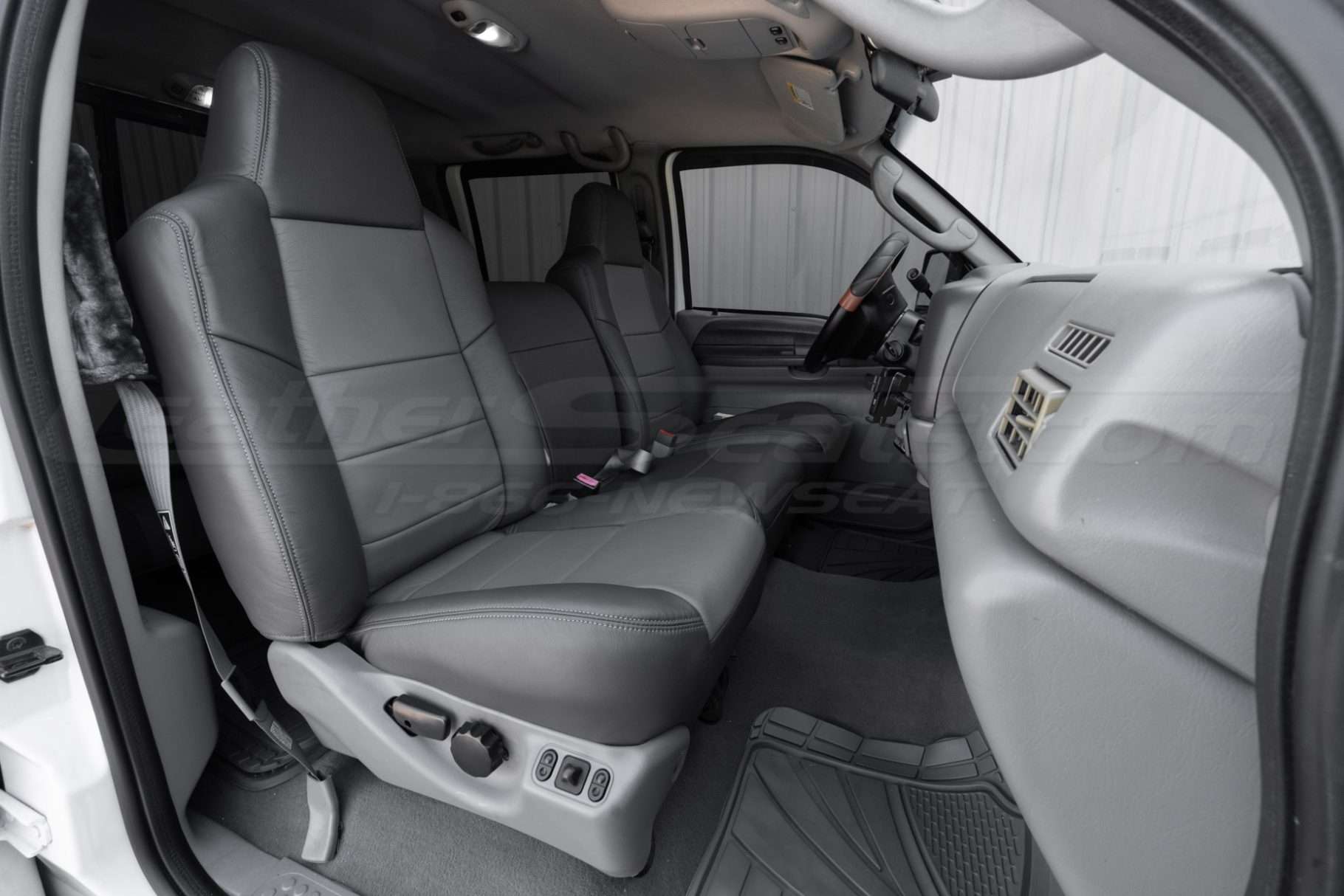 Ford superduty passenger side leather seat with LeatherSeats.com upholstery installed - Jump seat in sitting position