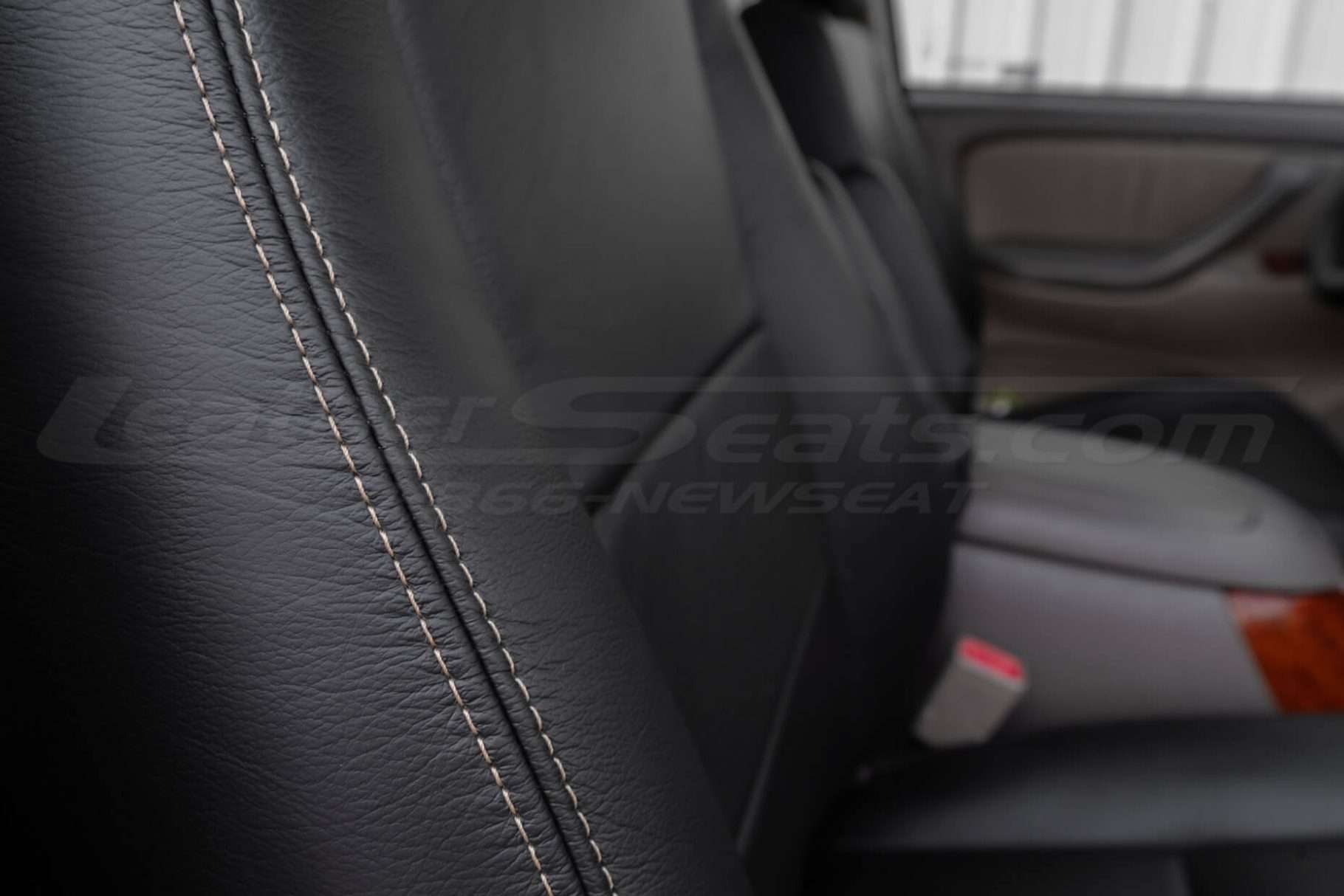 Contrast Adobe double-stitching on black leather