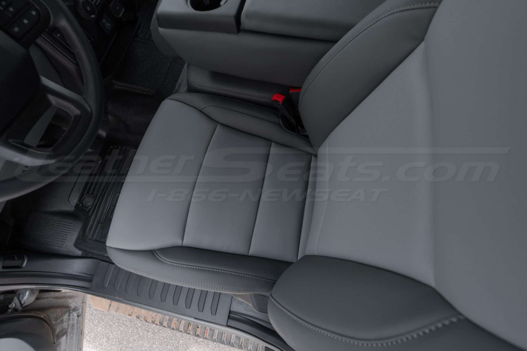 Top-down view of installed driver leather seat - Crater Grey leather texture