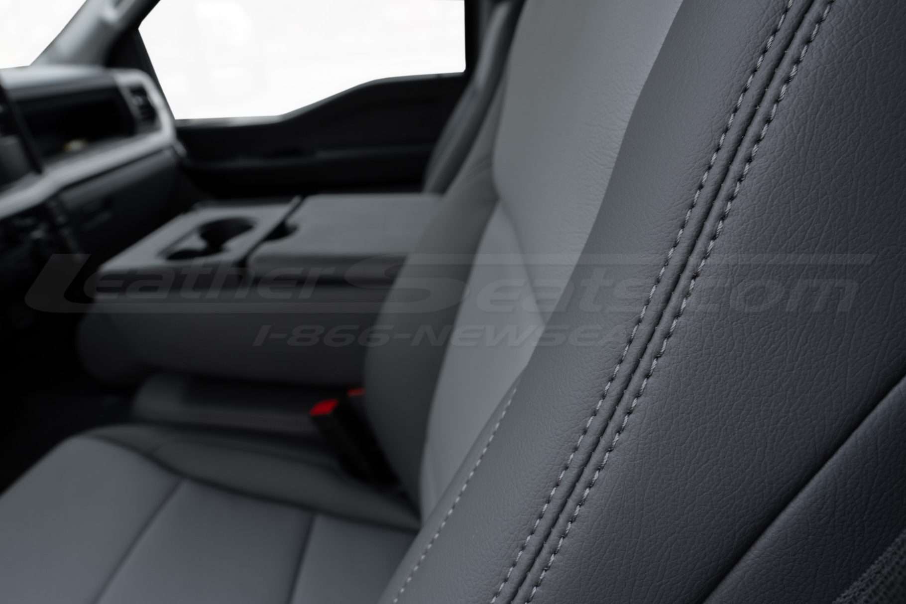 Charcoal double-stitching close-up on matching charcoal leather