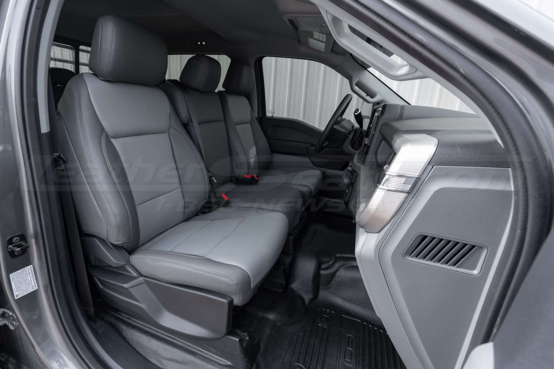 2023-2025 Ford SuperDuty with custom two-tone installed leather seats in charcoal & crater grey - Front seat passenger side 40/20/40