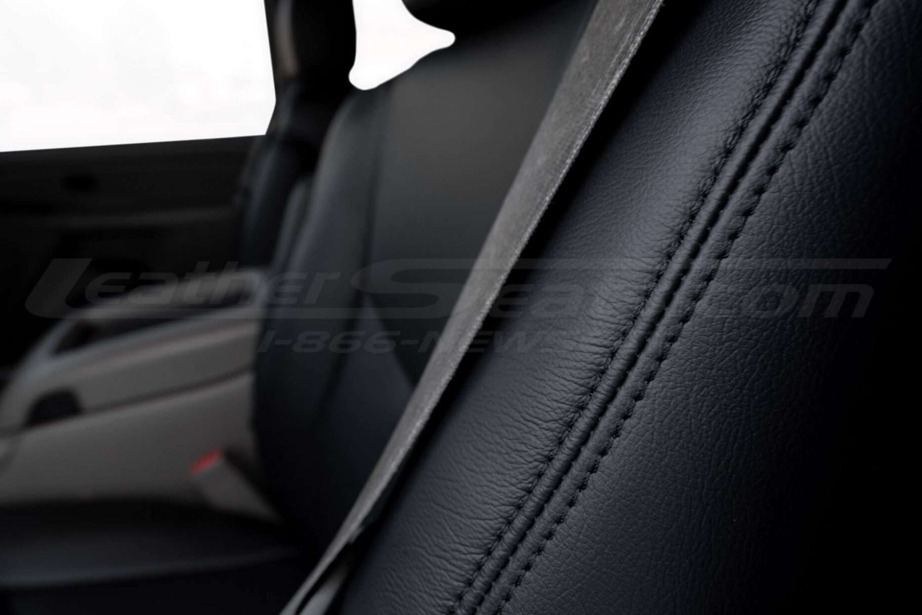 Matching Black stitching on Black leather close-up . Premium chevrolet tahoe leather seat covers