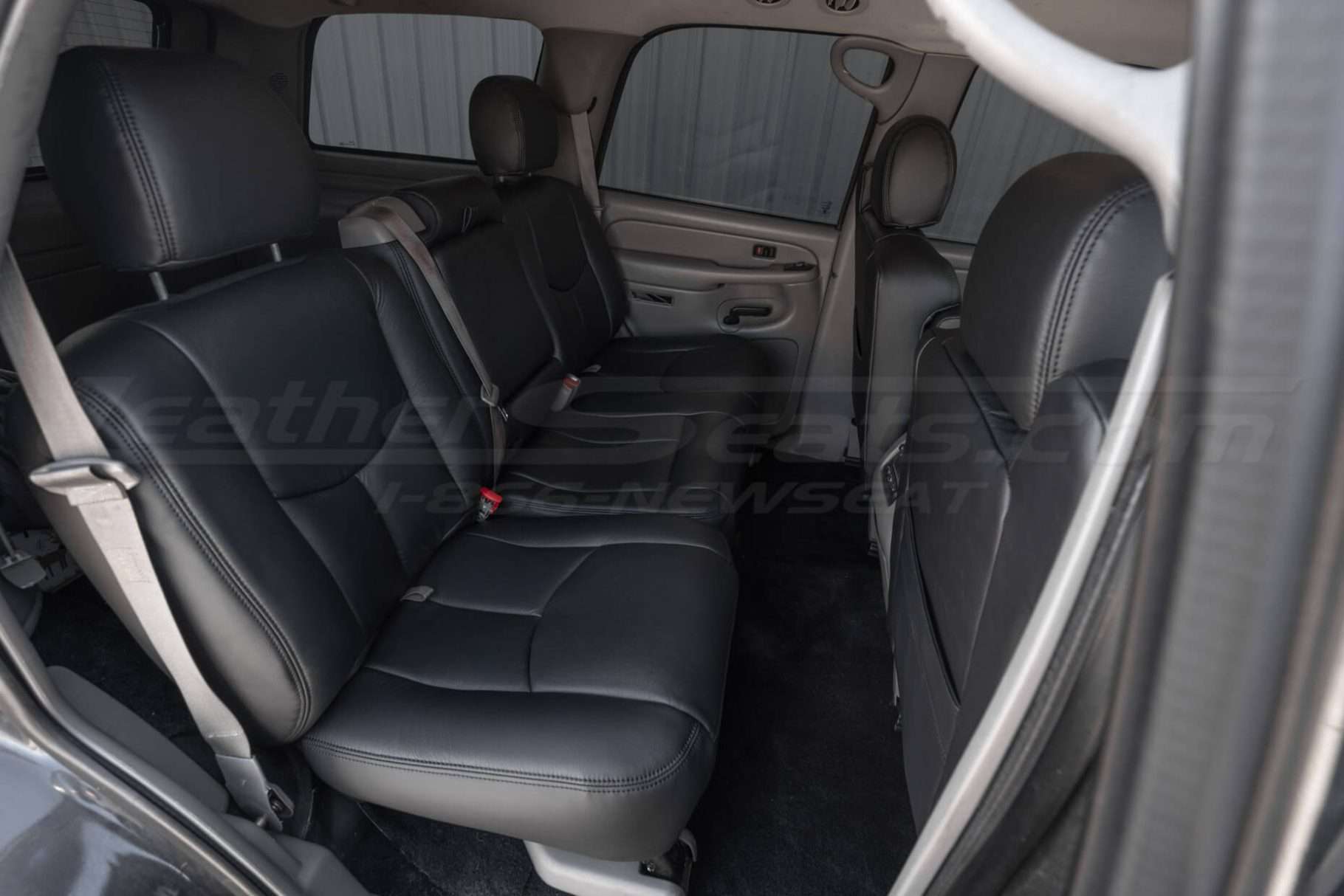 Chevrolet Tahoe with installed rear leather seats in aftermarket black leather kit