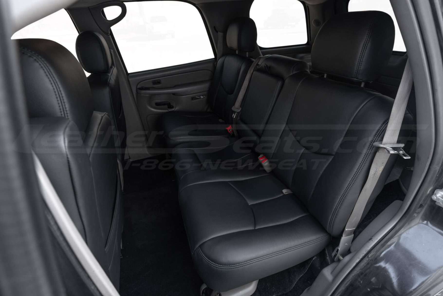 2003-2006 Chevrolet Tahoe with installed premium black leather seats - Rear seats from driver side