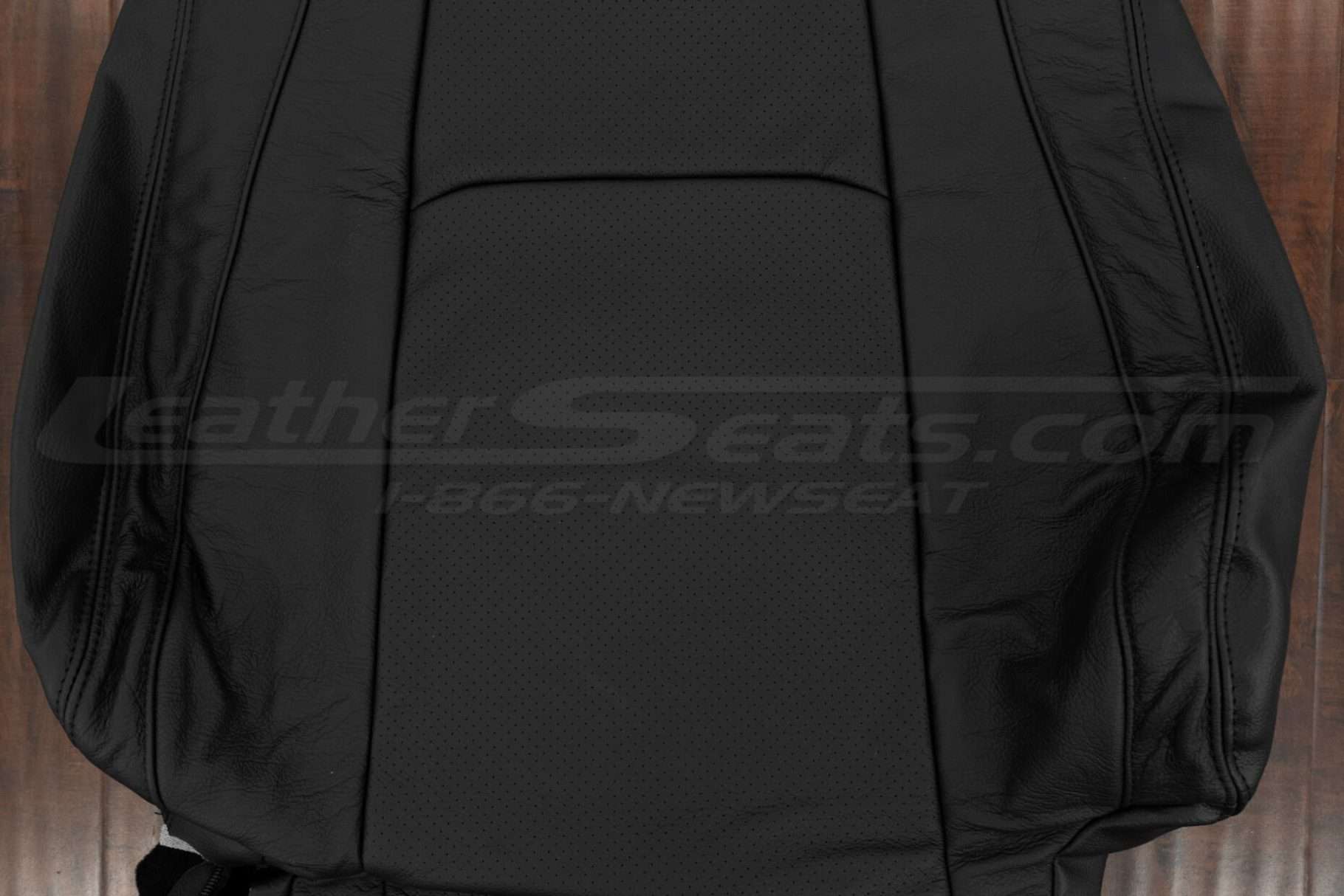 Perforated Body section of black leather backrest upholstery