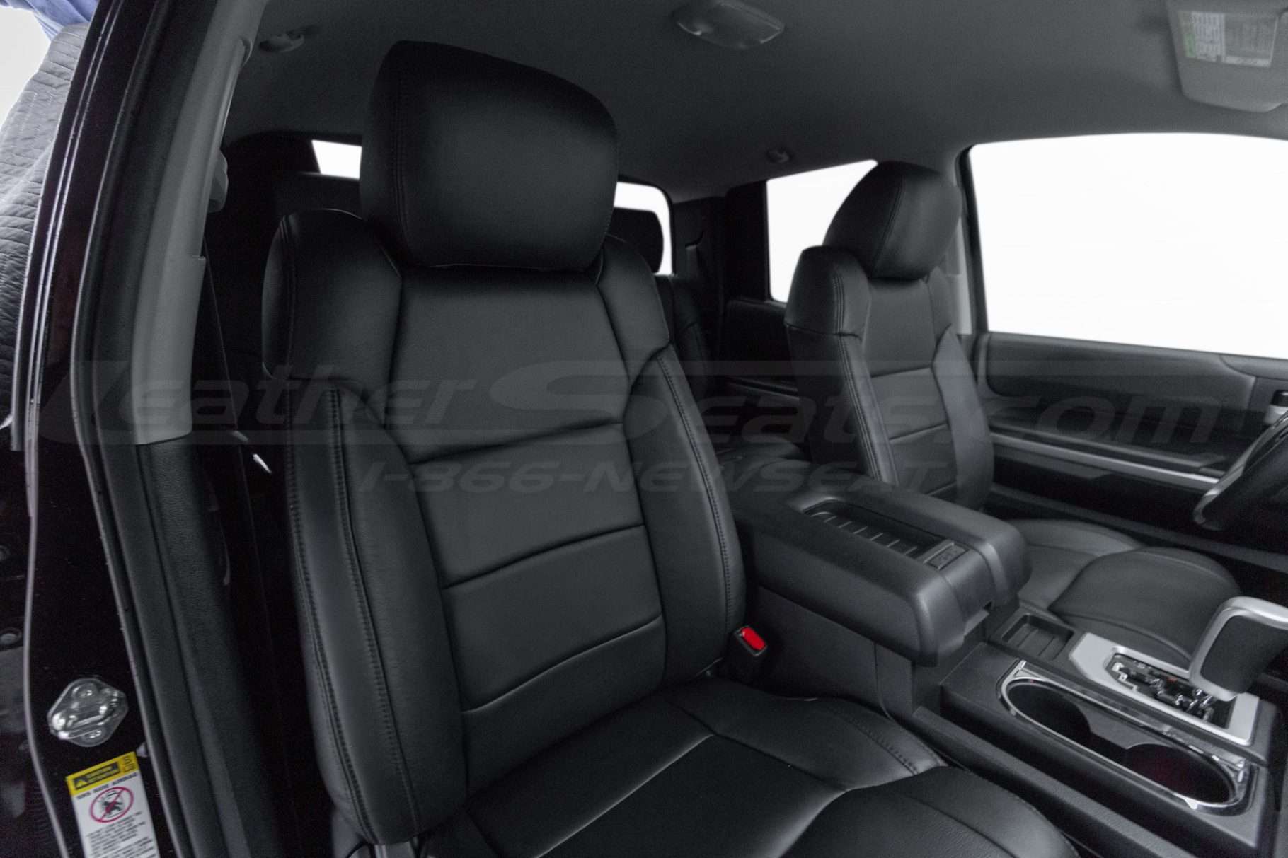 Front backrest and headrest section of installed passenger leather seat