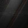Red double-stitching on console lid close-up