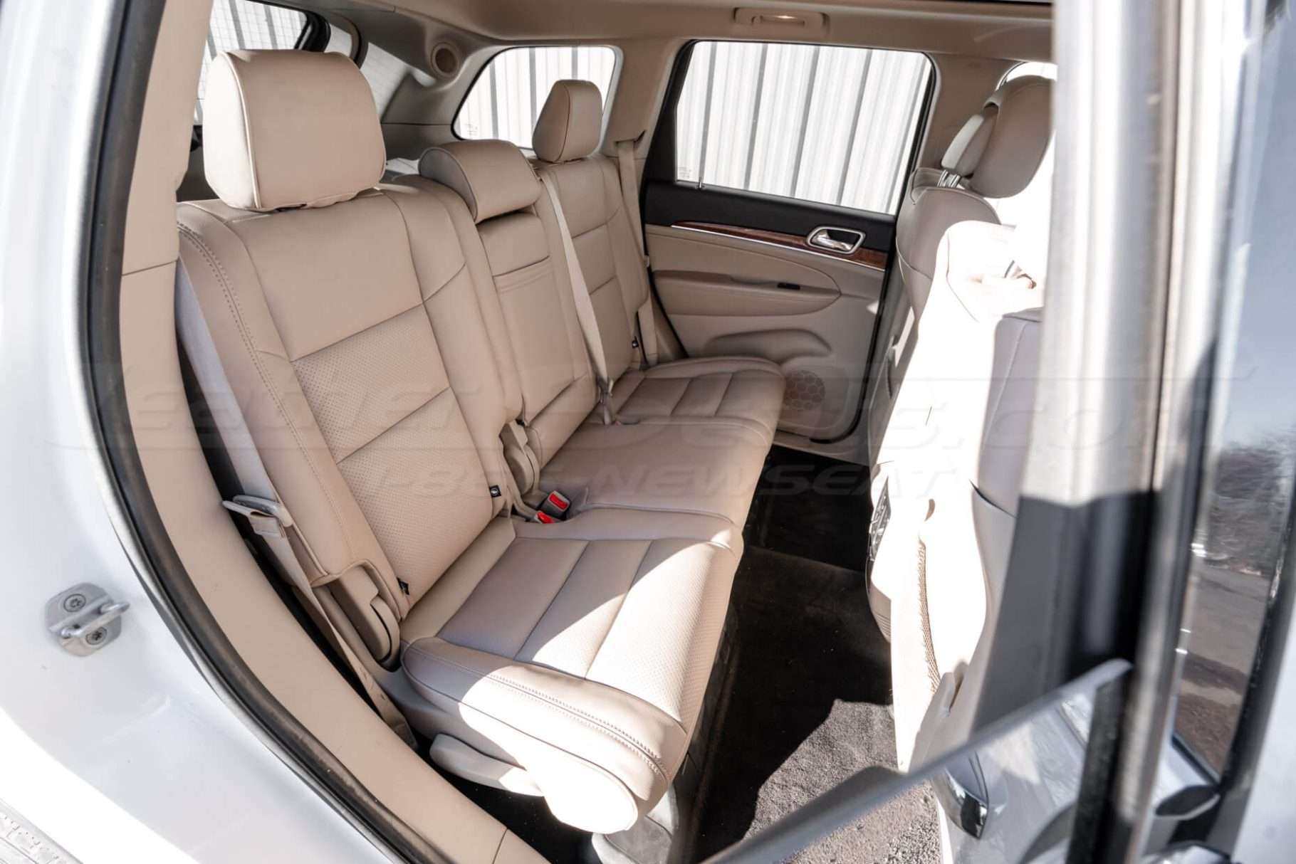Jeep Grand Cherokee aftermarket leather seat covers installed - Rear seats passenger side