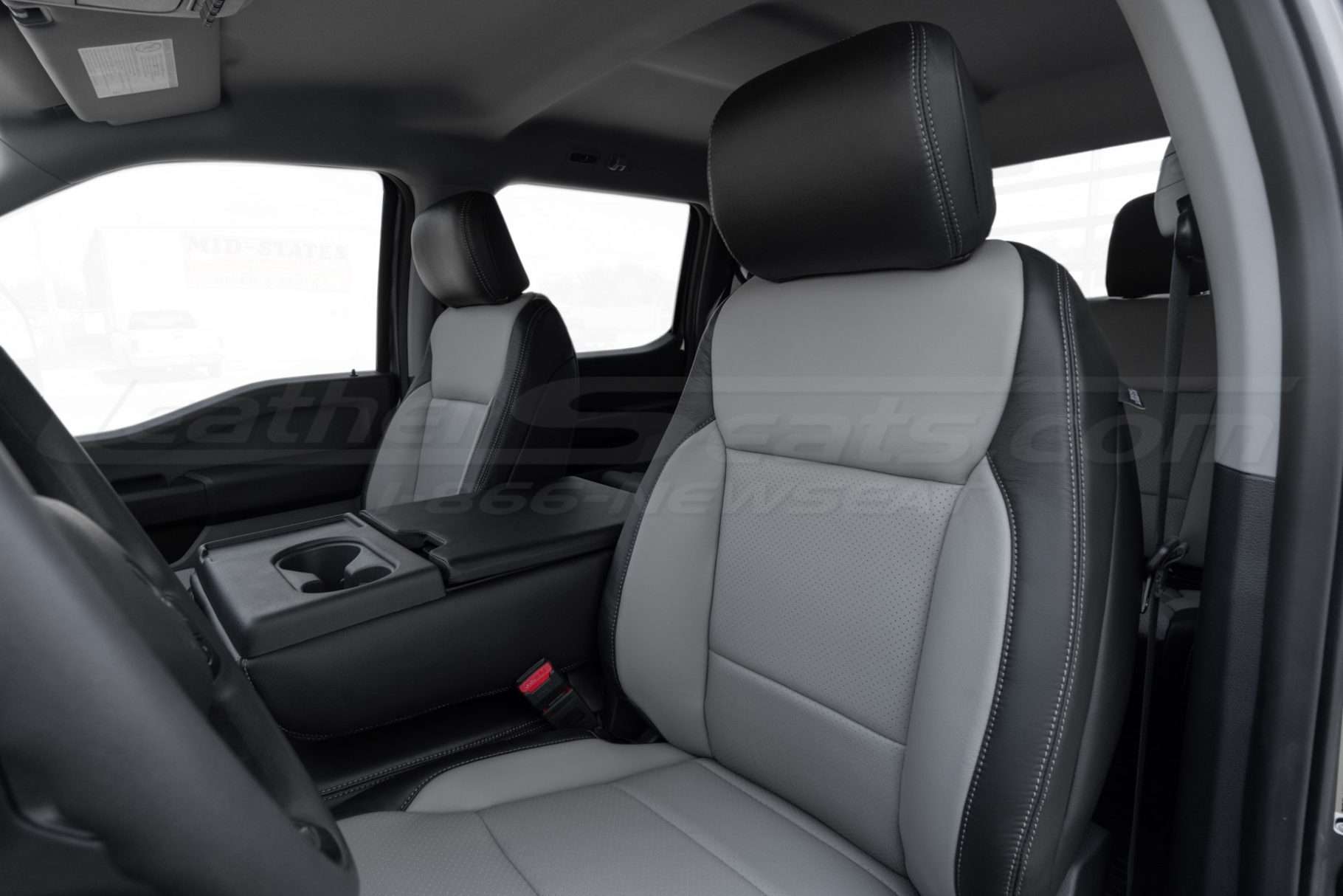 Front backrest and headrest section of installed leather seats