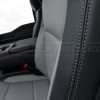 Contrasting ash double-stitching on Black leather side bolster