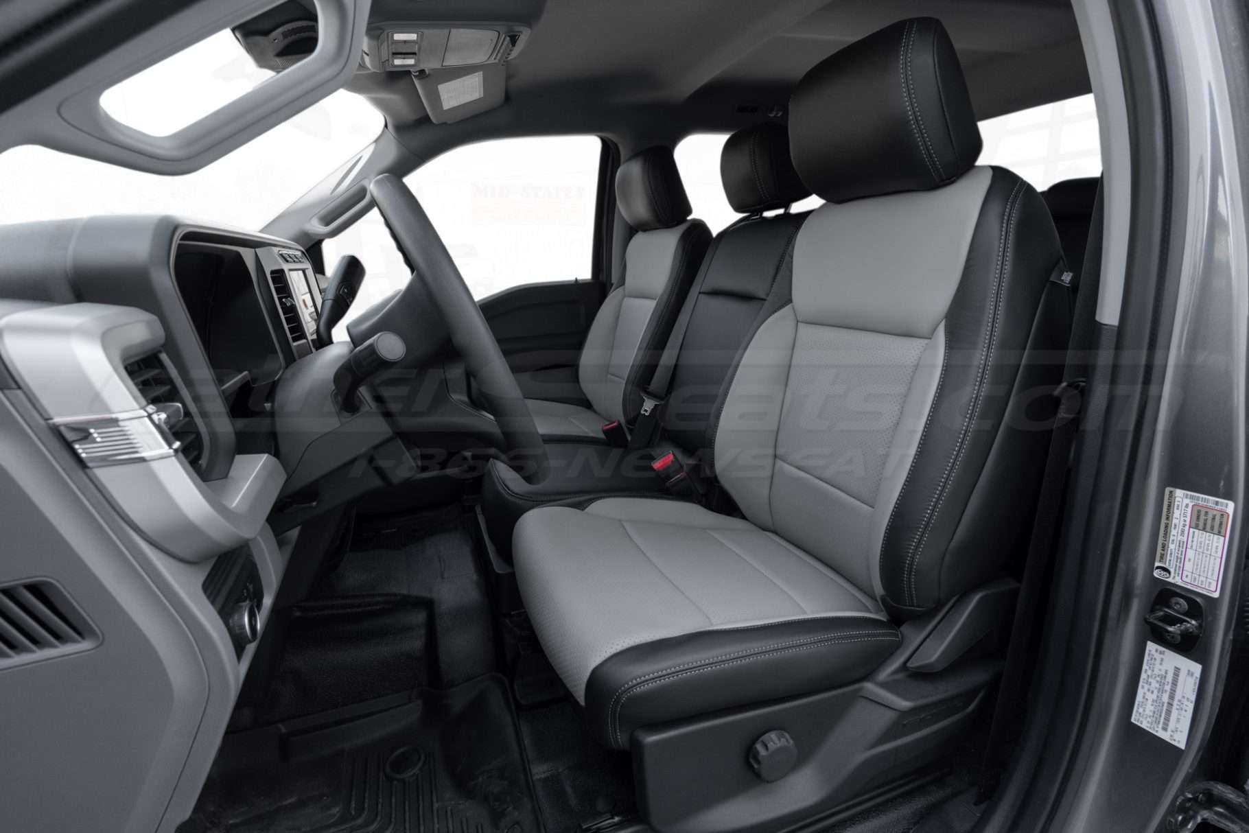 2024 Ford F-350 with aftermarket installed leather seats - front driver seat with jump seat up