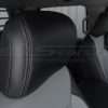 Installed black leather headrest close-up with contrast Ash stitching