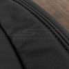 Matching Black double-stitching on black leather close-up