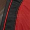 Alternative side view of bright red piping on black leather