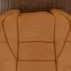 Upper section of perforated leather backrest