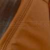 Burnt orange stitching on burnt orange leather