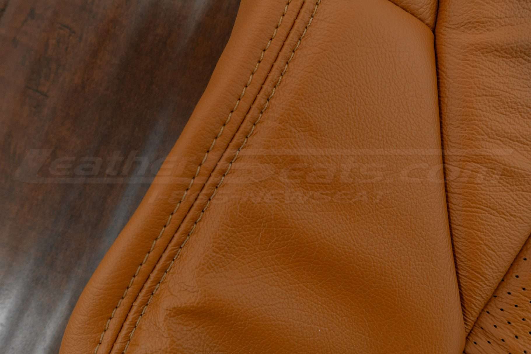 Burnt orange stitching on burnt orange leather