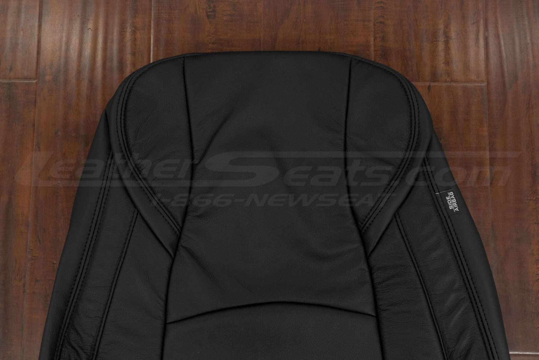 Upper section of leather backrest upholstery
