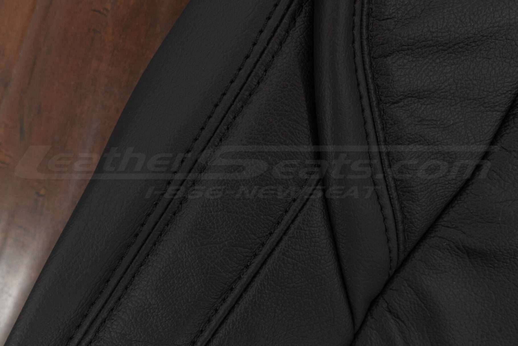 Opposite side view of black stitching on black leather