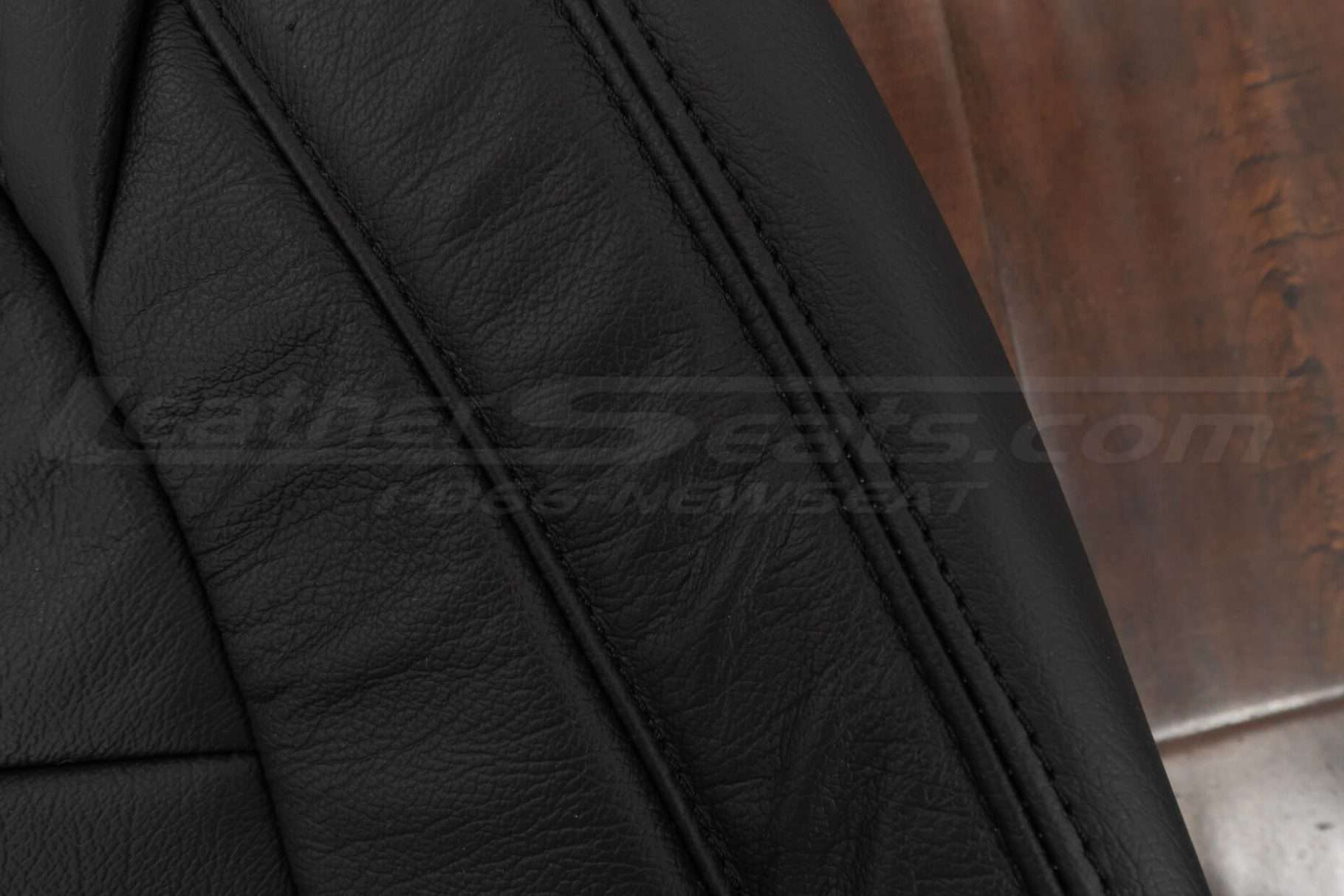 Matching double-stitching on black leather