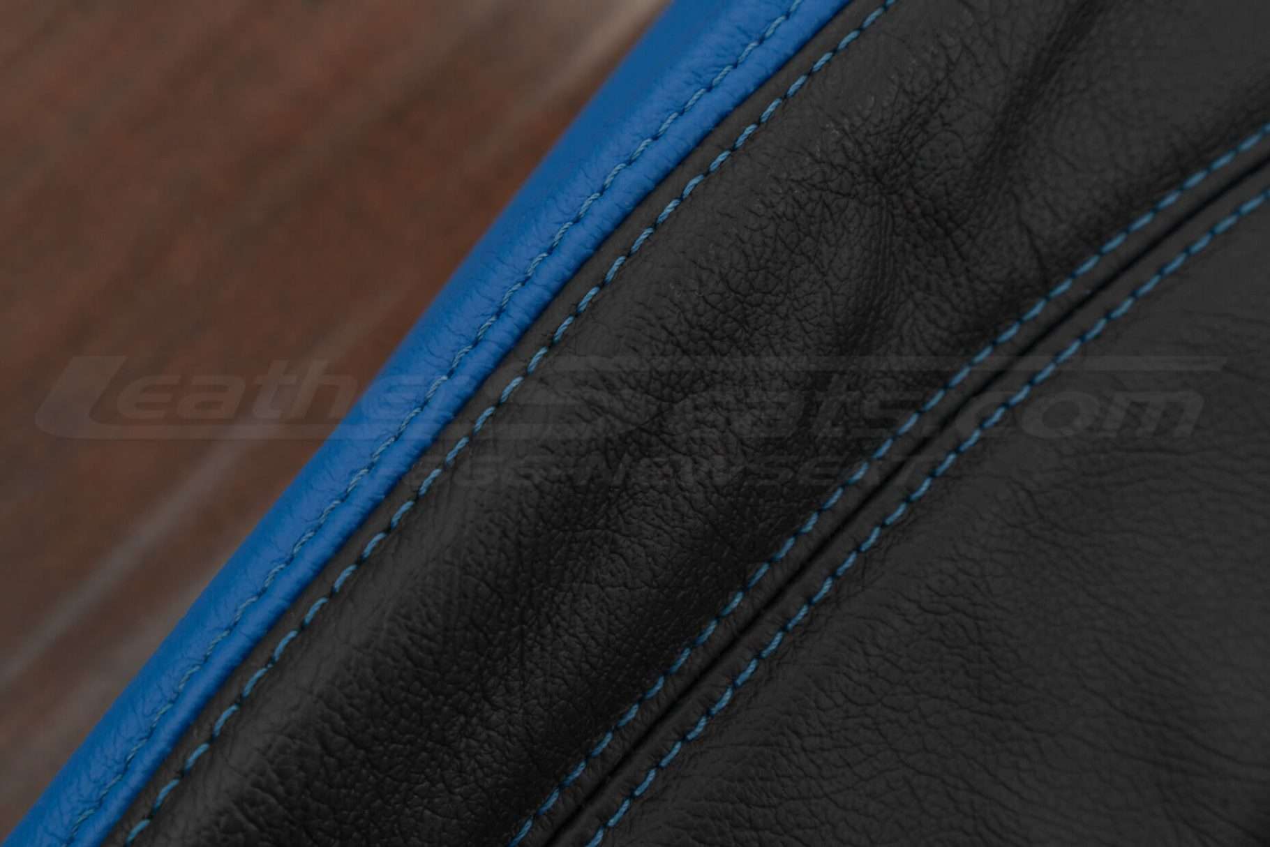 Cobalt stitching on black and cobalt leather