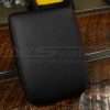 Top-down side view of aftermarket leather console lid cover for Toyota Tacoma