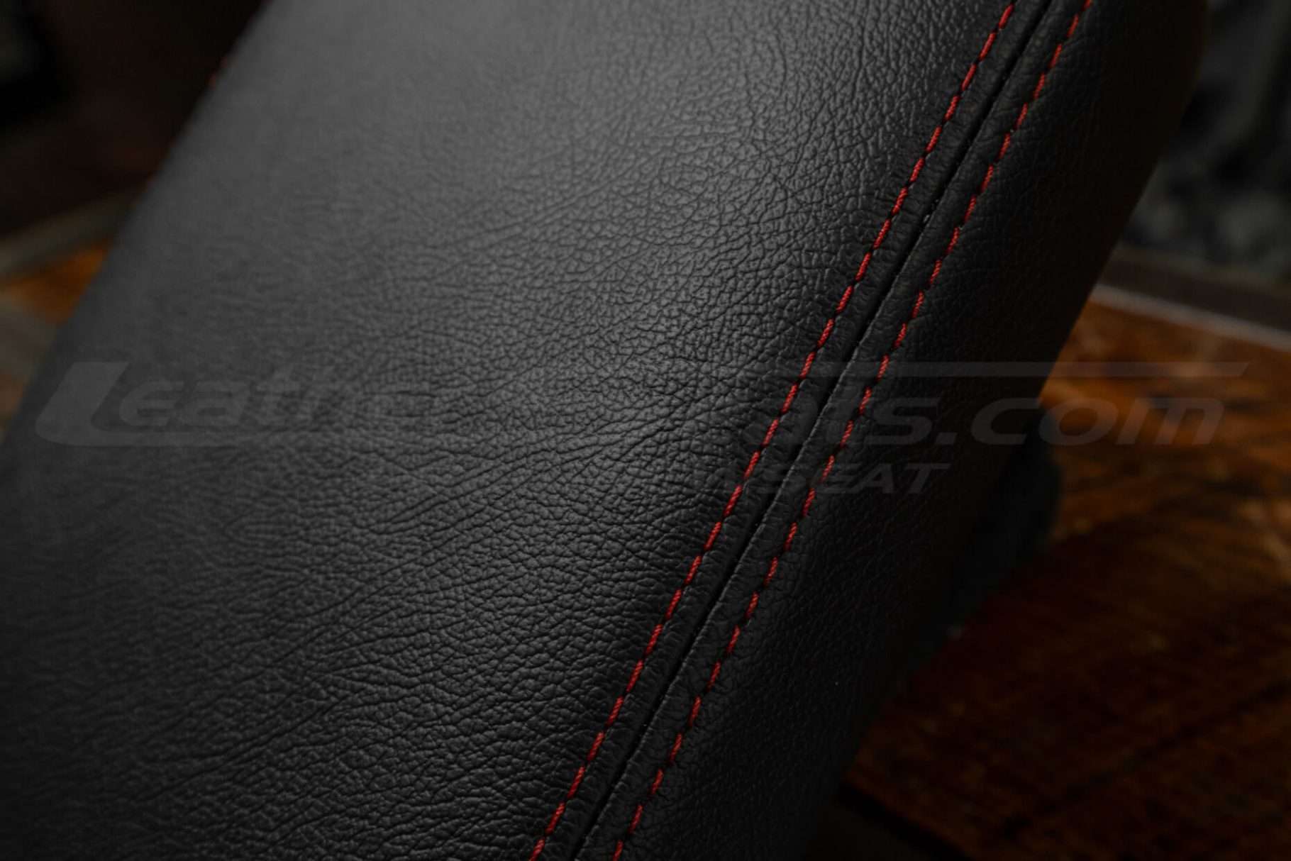 Contrast Red double-stitching on Tacoma console cover