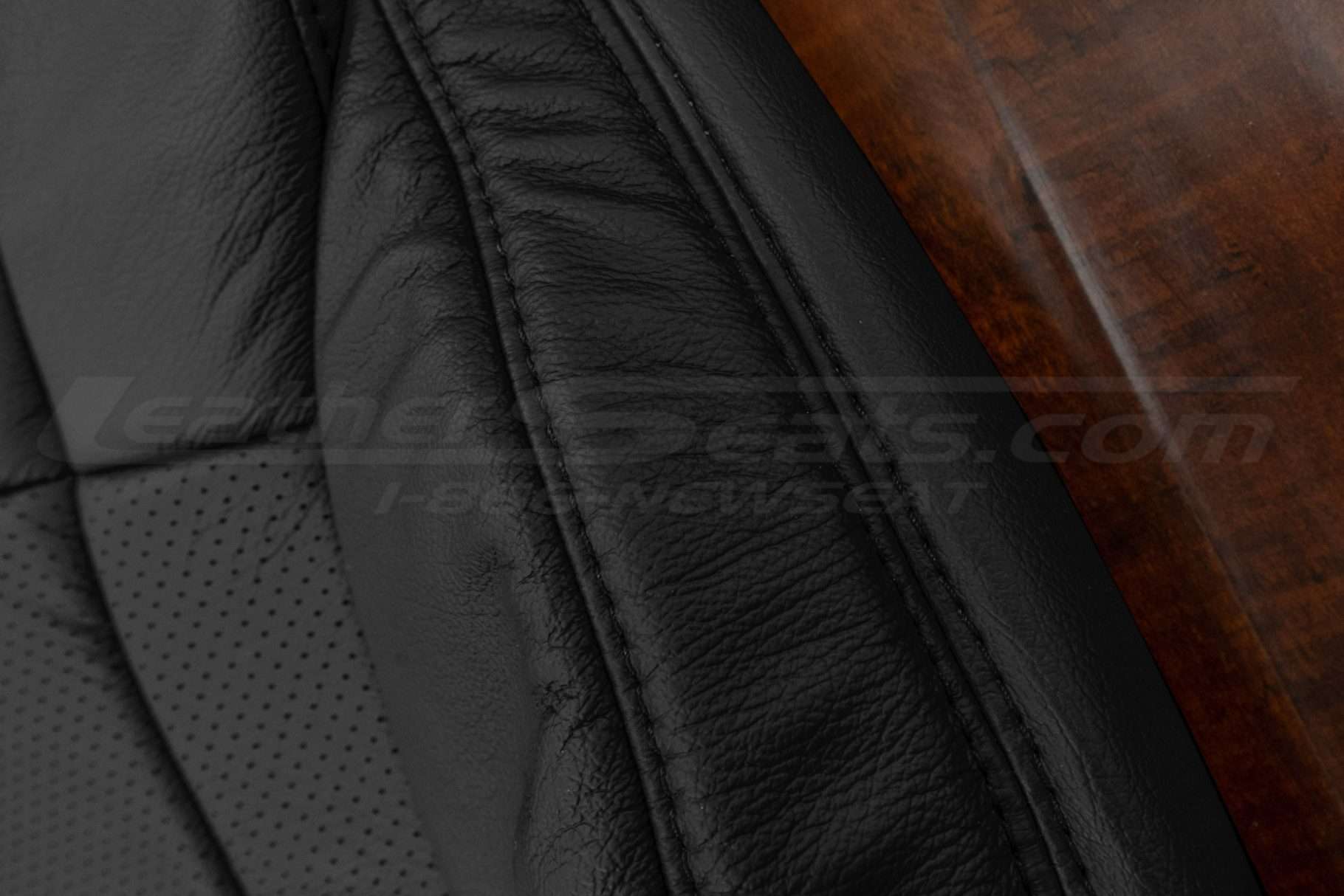 Black double-stitching on matching Black leather