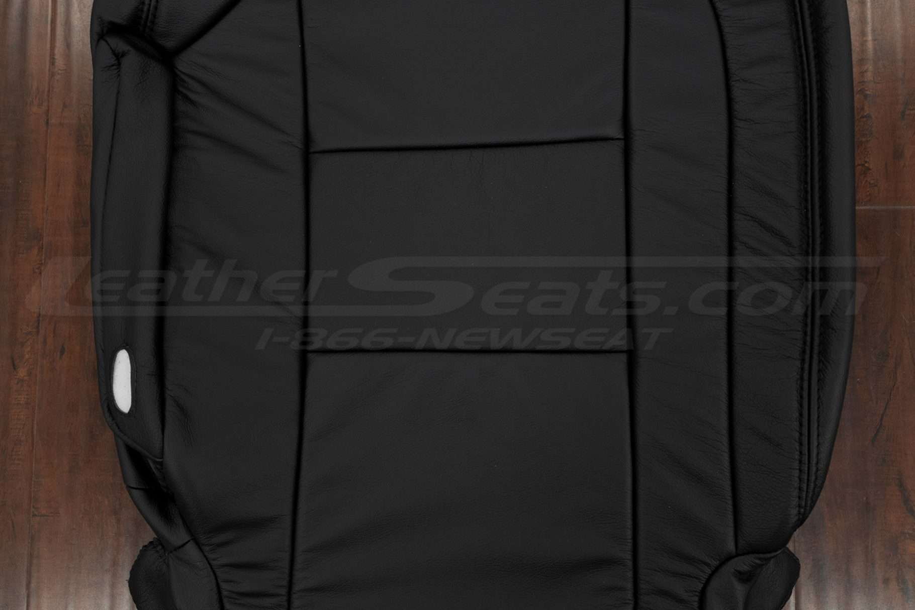 Insert section of black leather Nissan Armada backrest