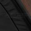 Black double-stitching on black leather