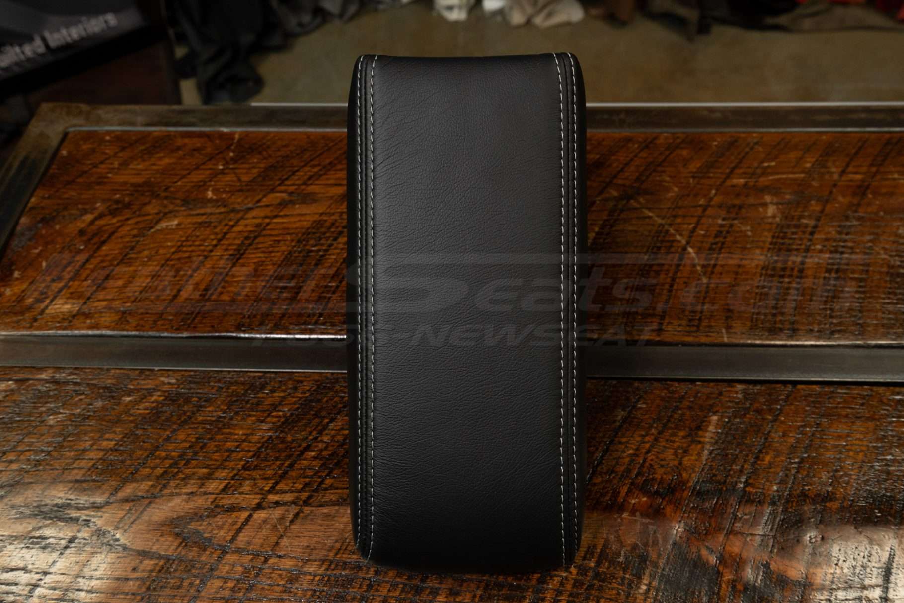 Top-down view of Acura Legend leather center console lid cover in Black