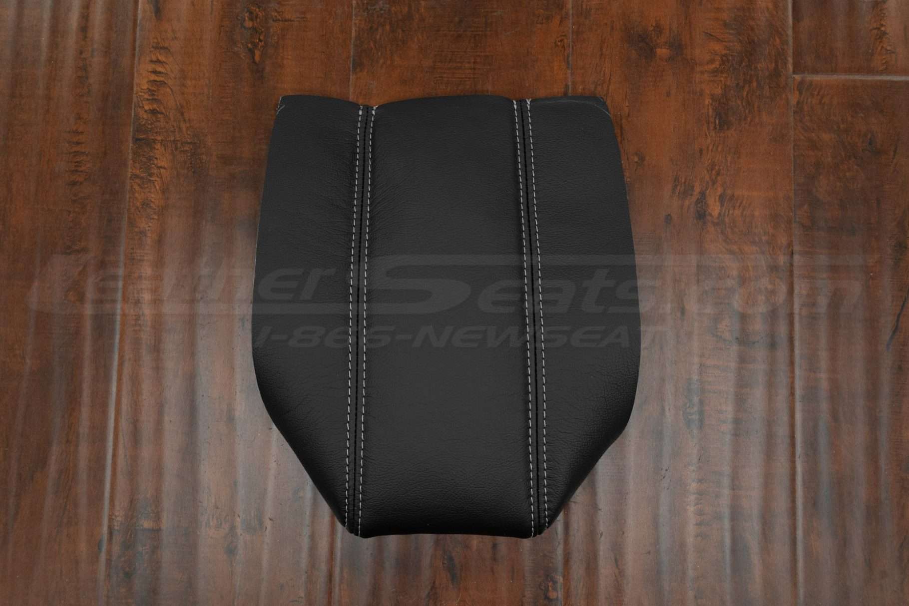 Top-down flat lay of Acura Legend leather console lid cover with contrast stitching