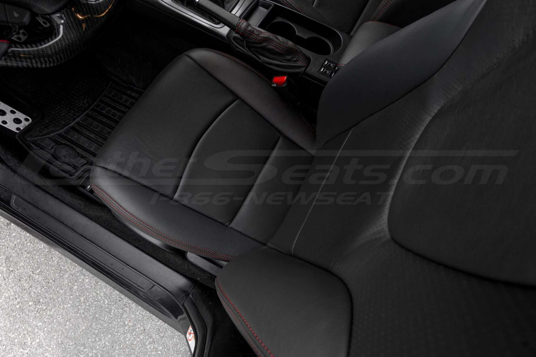 Top-down view of perforated combo section of front driver leather seat