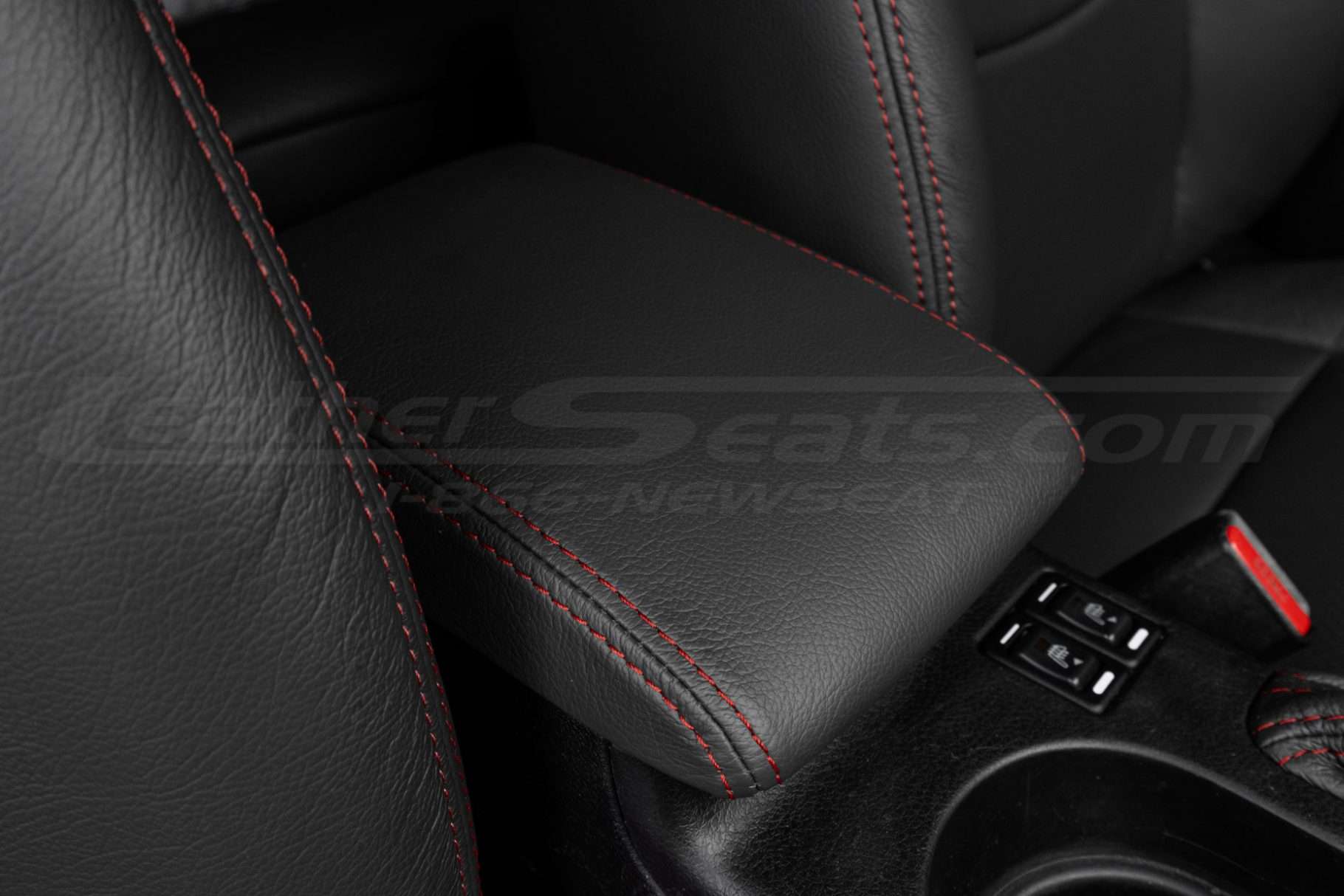 Close up of Dark Graphite with contrast Red stitching leather console lid cover - installed