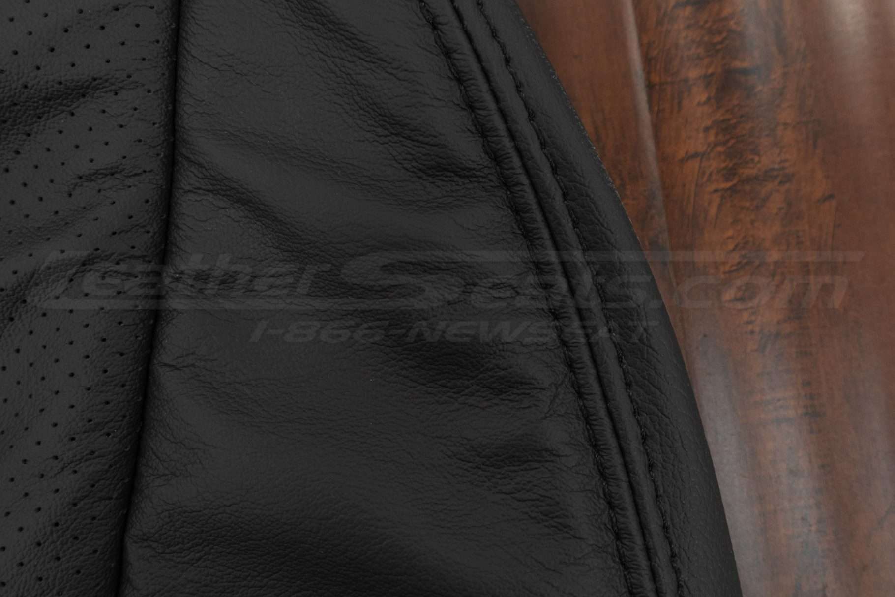 Matching black double-stitching on black leather