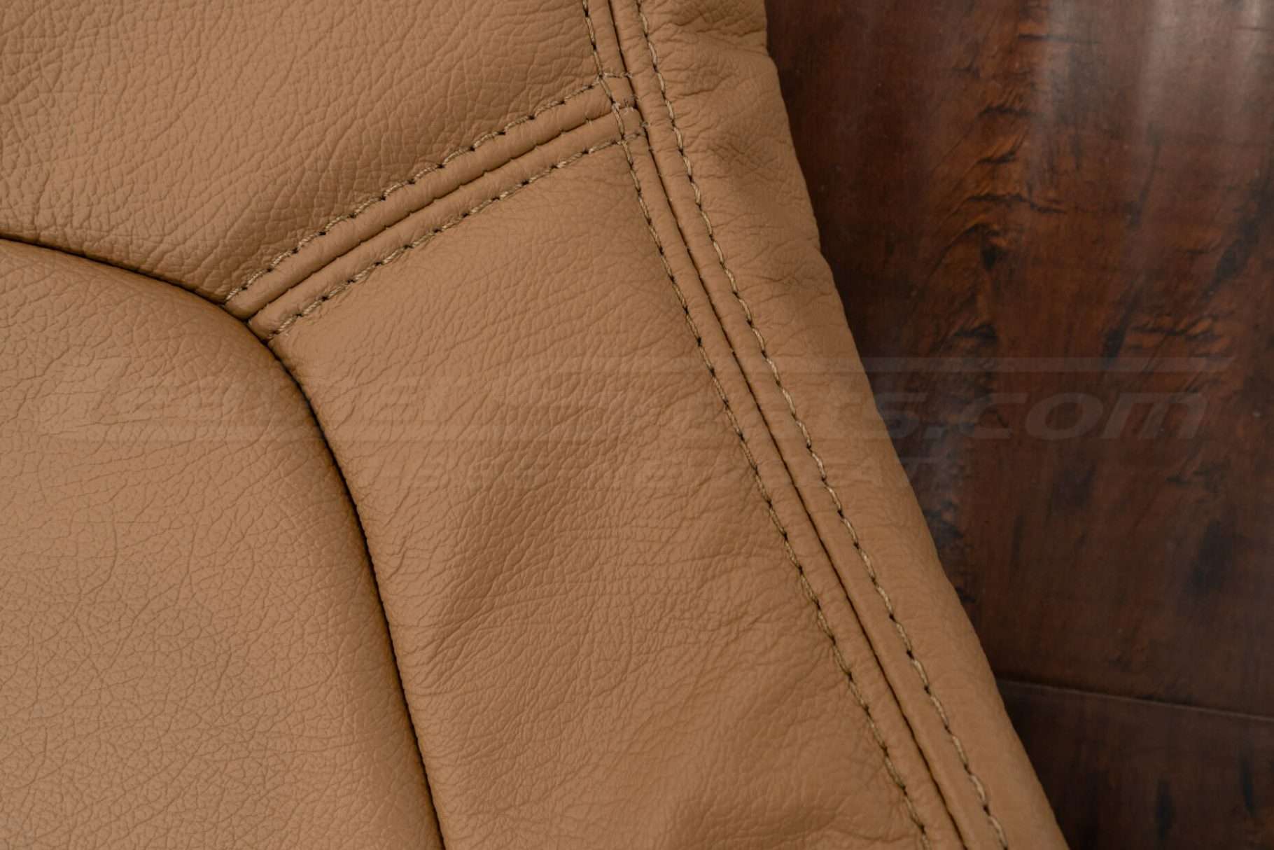 Tan double-stitching on Tan leather