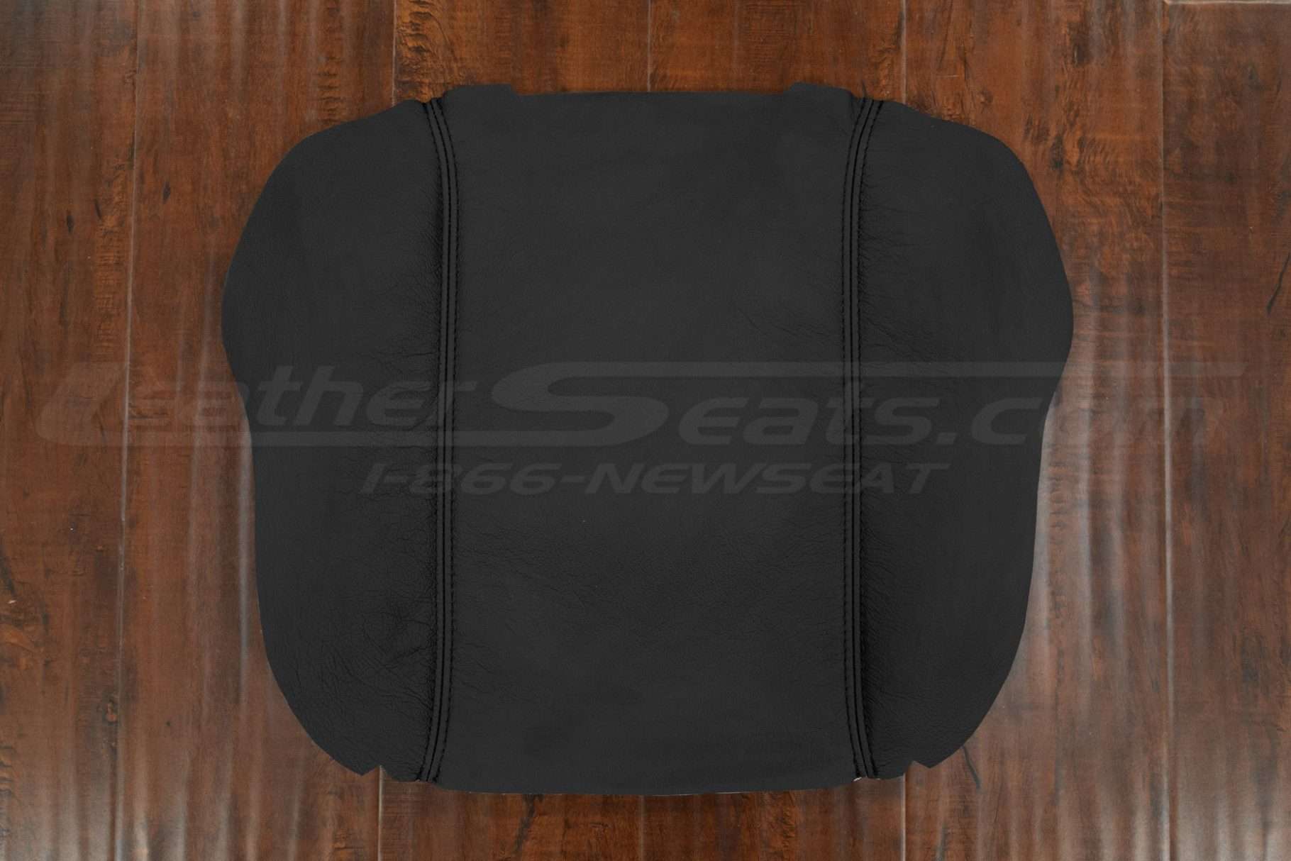 Top-down flat lay of 2019-2025 Dodge Ram leather console lid cover upholstery in Black