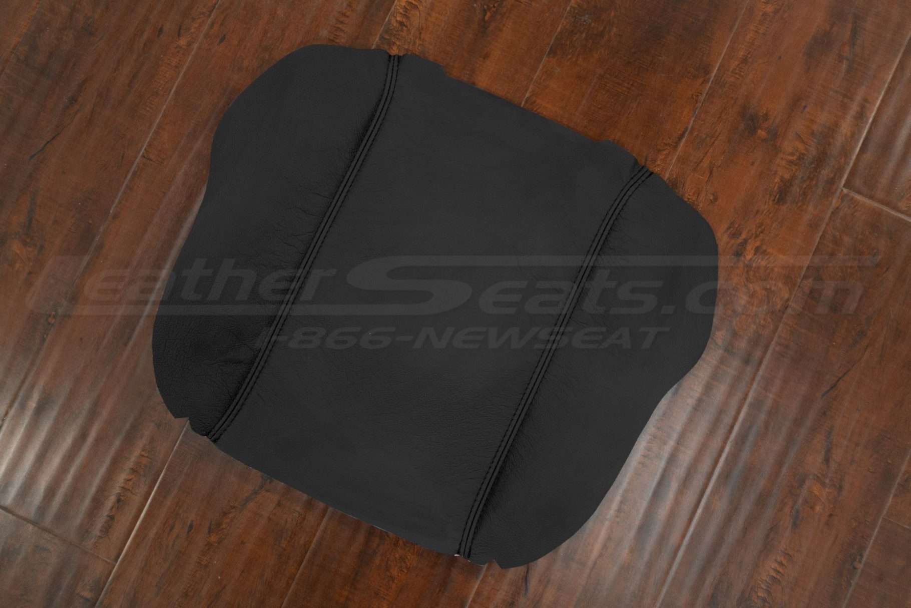 Side flat lay of leather console lid cover upholstery for Dodge Ram trucks