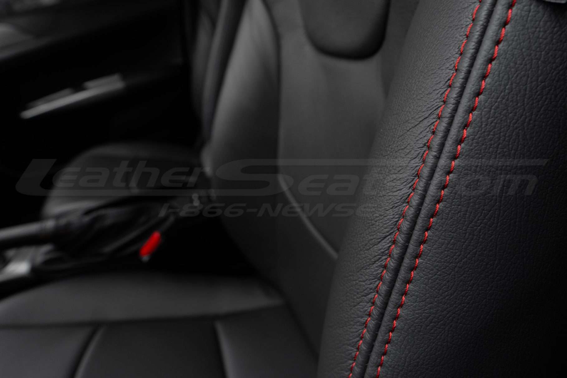 Contrasting Red stitching on black leather bolster - installed