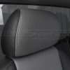 Two-tone installed leather head rest close-up in black and light grey