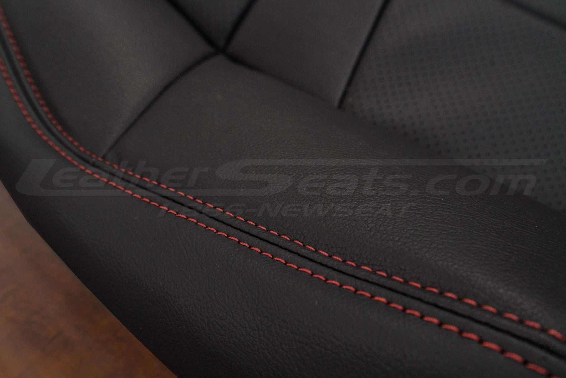 Contrast Red double-stitching on Black leather