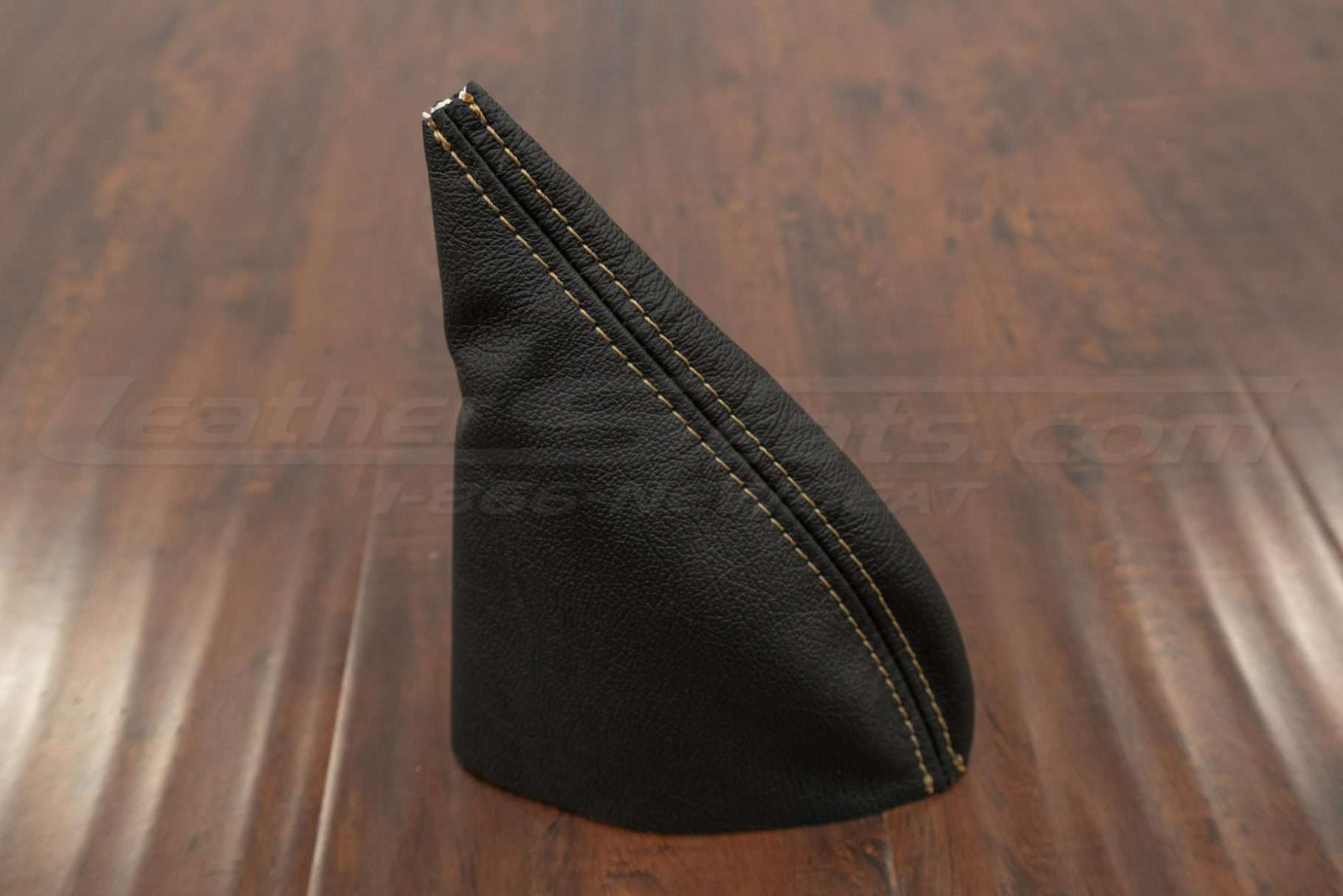 Standing view of leather ebrake boot upholstery in black leather with doe skin stitching