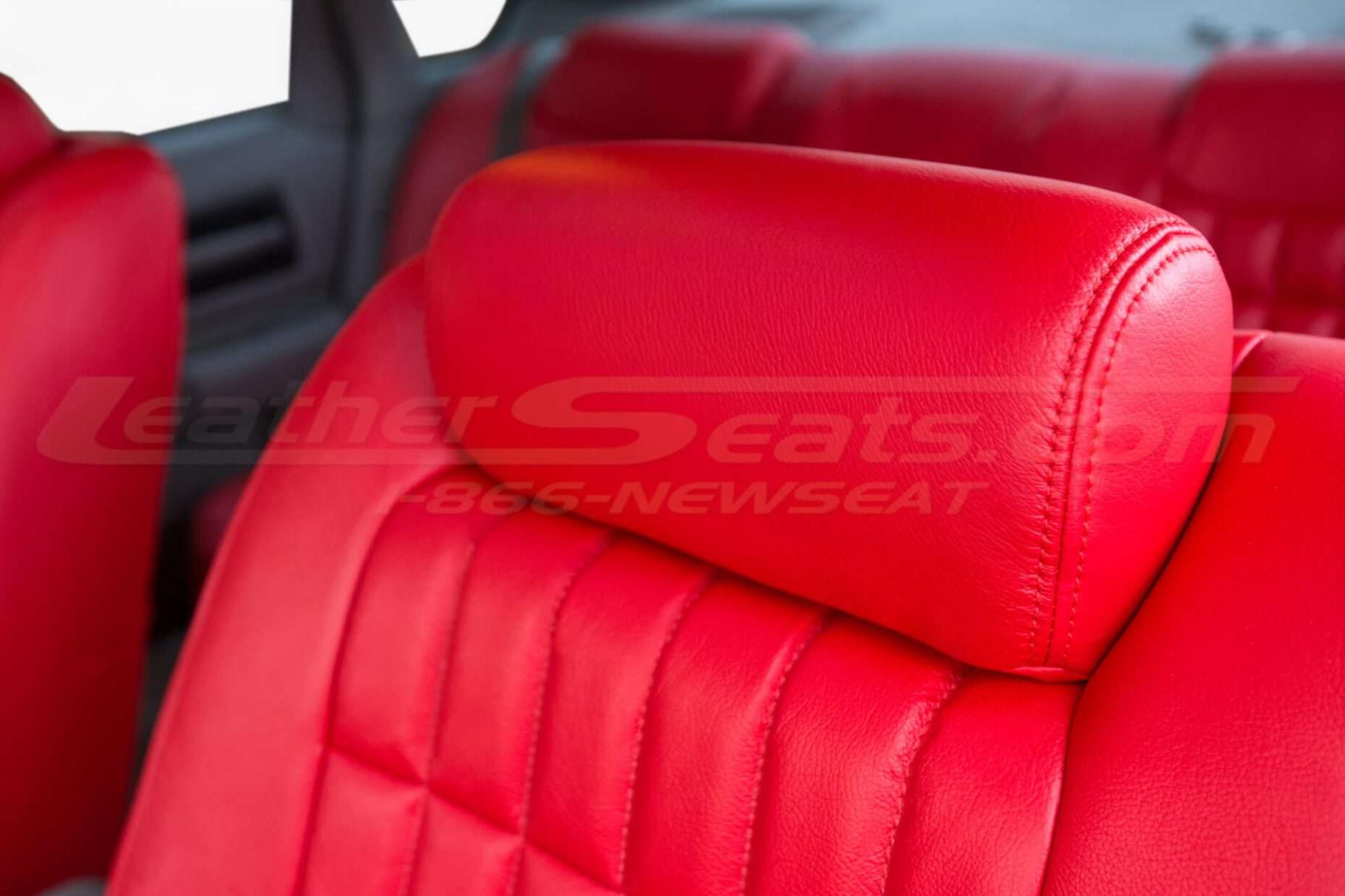 Bright Red leather impala ss headrest close-up