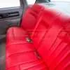 Bright red impala SS rear armrest folded up