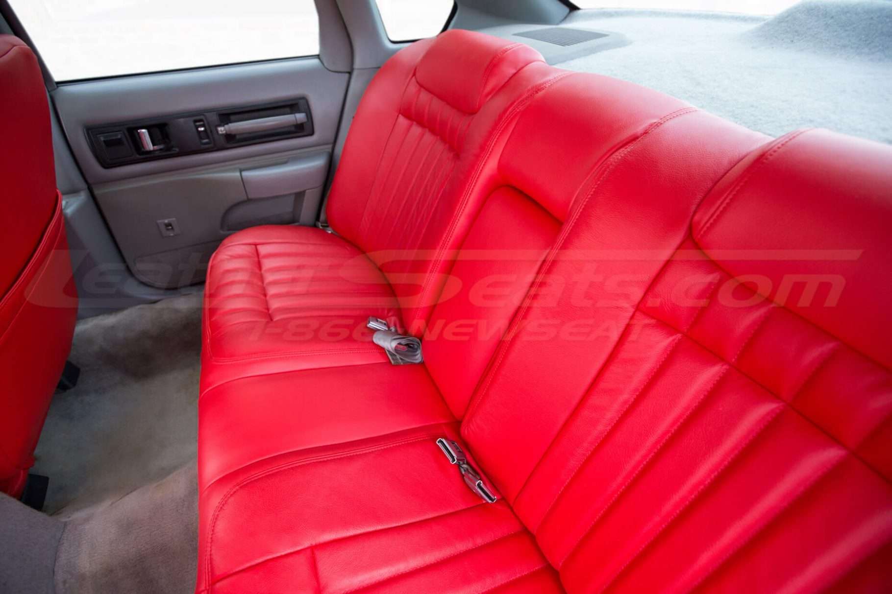 Bright red impala SS rear armrest folded up