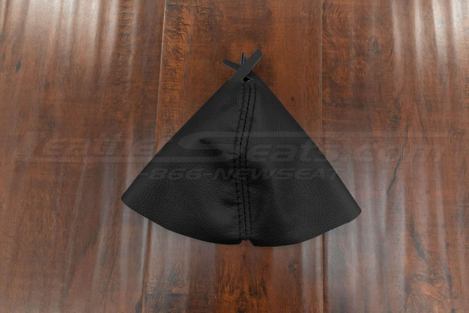 Flat lay of black leather shift boot upholstery